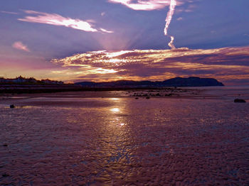 Scenic view of sea against sky at sunset