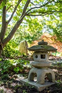 Statue against trees