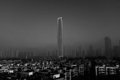 Modern buildings in city against clear sky