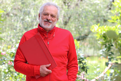 Portrait of smiling man standing outdoors