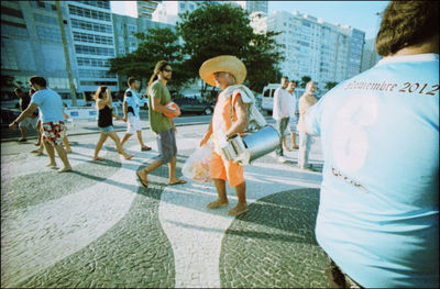 Group of people walking on street