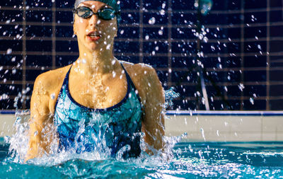 Woman swimming in pool