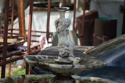 Close-up of statue against fountain