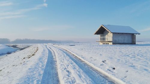 Scenic view of beach against sky during winter