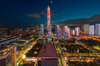 Illuminated buildings against sky at night