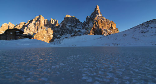 Italy, dolomities unesco heritage. scenic view of snowcapped  montains against clear sky. 