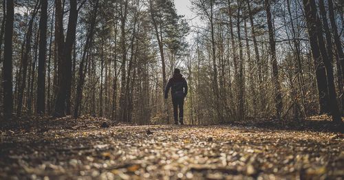 Man and woman in forest during winter