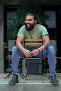 Portrait of man sitting on chair