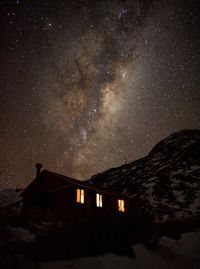 Low angle view of building and the milky way 