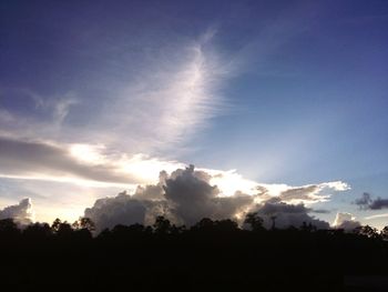 Low angle view of cloudy sky at sunset