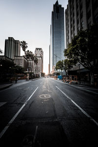 Road in city against clear sky