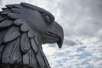 Low angle view of statue against sky