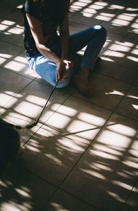 Low section of woman standing on floor