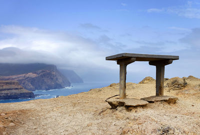 Monument structure against calm sea