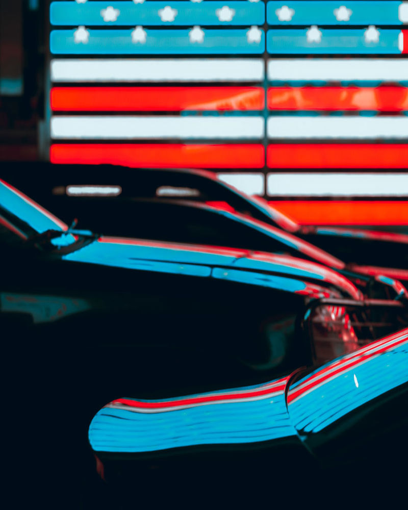 CLOSE-UP OF ILLUMINATED RED CAR