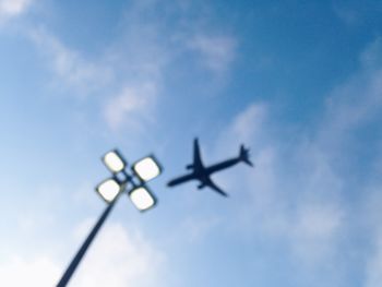 Low angle view of street light against blue sky