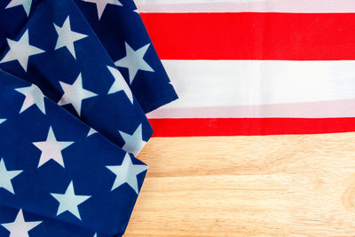 Close-up of flag against blue wall