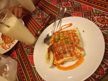 Close-up of hand served in plate on table