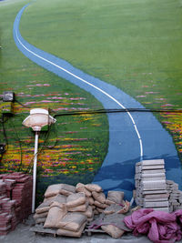 Empty narrow road along countryside landscape