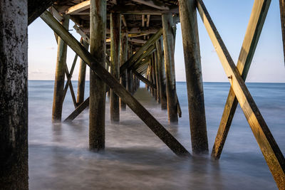 Pier over sea against sky