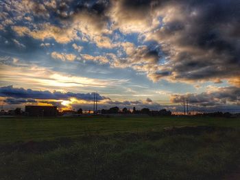 Scenic view of dramatic landscape against cloudy sky