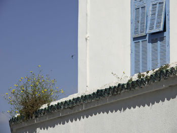 Low angle view of building against clear blue sky