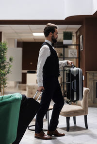 Side view of man working in gym