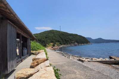 View of calm sea against clear blue sky