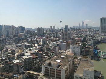 High angle view of buildings in city against sky