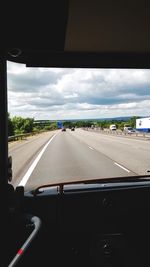 Road passing through car windshield