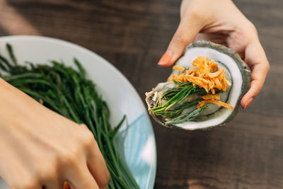 High angle view of person having food in plate