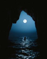 Scenic view of sea seen through cave