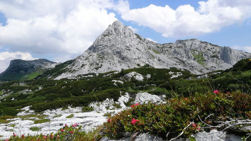 Scenic view of mountains against cloudy sky