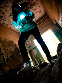 Low angle view of illuminated lighting equipment on rock