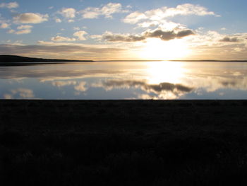 Scenic view of landscape against sky during sunset