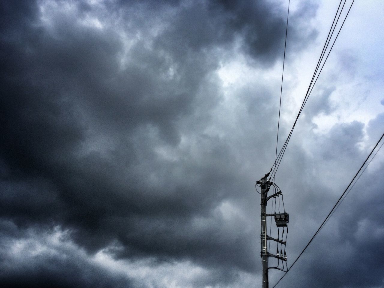 low angle view, sky, cloud - sky, cloudy, weather, power line, connection, cloud, overcast, cable, electricity, power supply, electricity pylon, outdoors, day, technology, no people, lighting equipment, pole, nature