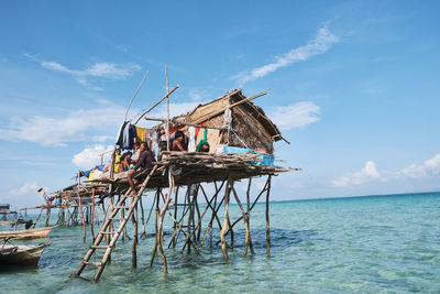 Traditional ship in sea against sky