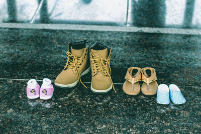 Close-up of shoes on flooring