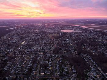 High angle view of city against sky during sunset