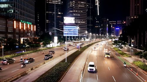 High angle view of traffic on city street at night