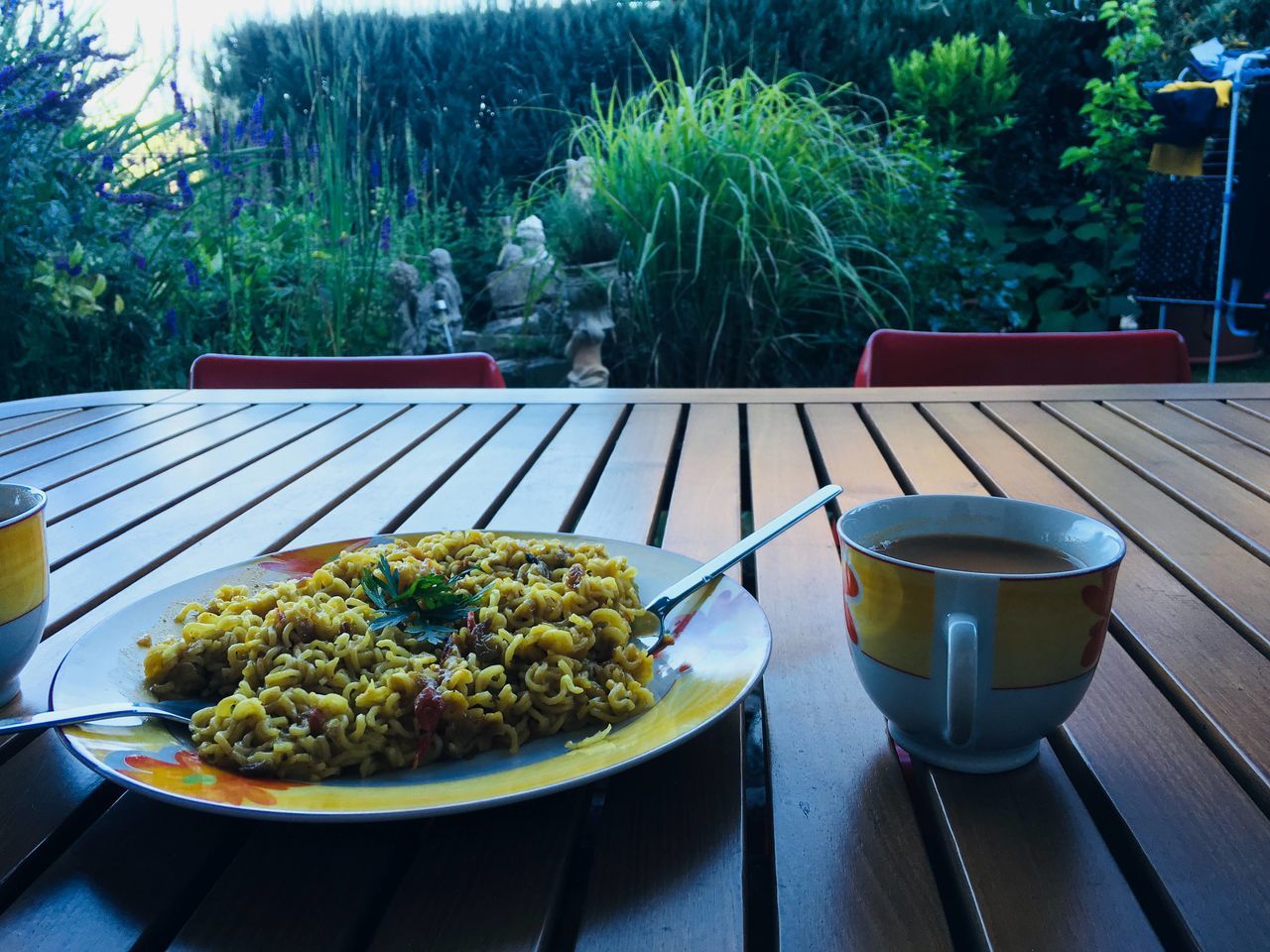 VIEW OF FOOD ON TABLE AGAINST TREES