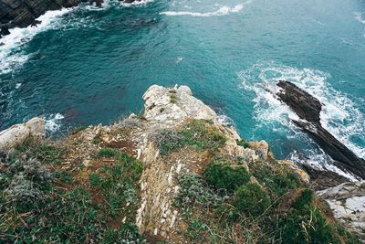 High angle view of rocks on sea