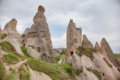 Low angle view of rock formation against sky