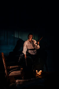 Young man sitting at music concert