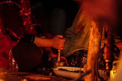 Midsection of woman preparing food