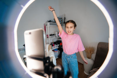 Girl teenager records video uses smartphone