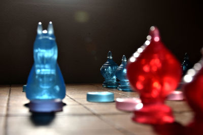 Close-up of chess pieces on table