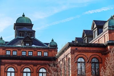 Low angle view of built structure against blue sky