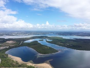 Scenic view of calm sea against cloudy sky