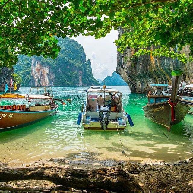 water, nautical vessel, boat, transportation, moored, mode of transport, tree, tranquility, tranquil scene, scenics, nature, beauty in nature, sea, day, travel, rock - object, idyllic, mountain, outdoors, waterfront